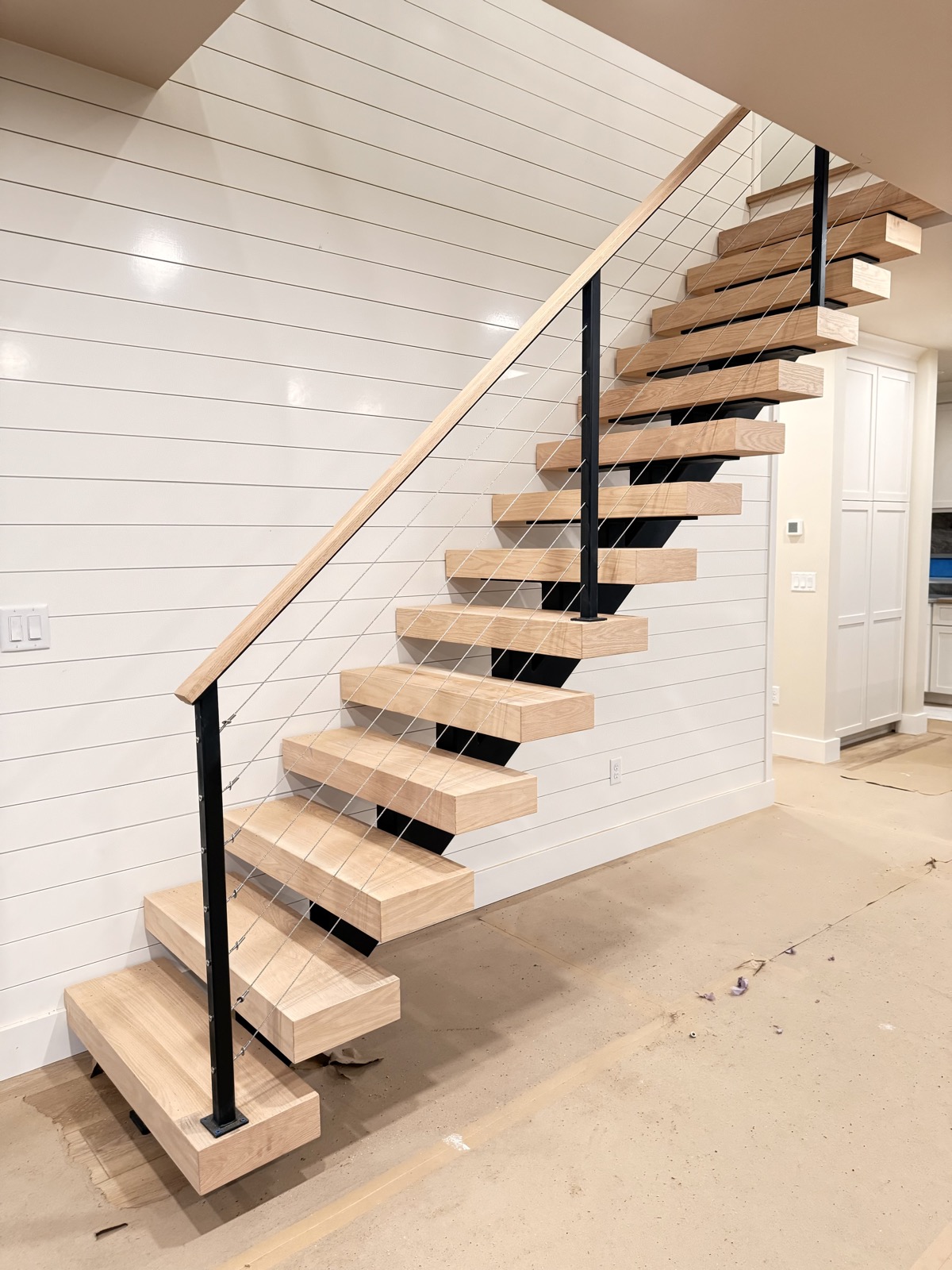 Floating staircase with cable railings