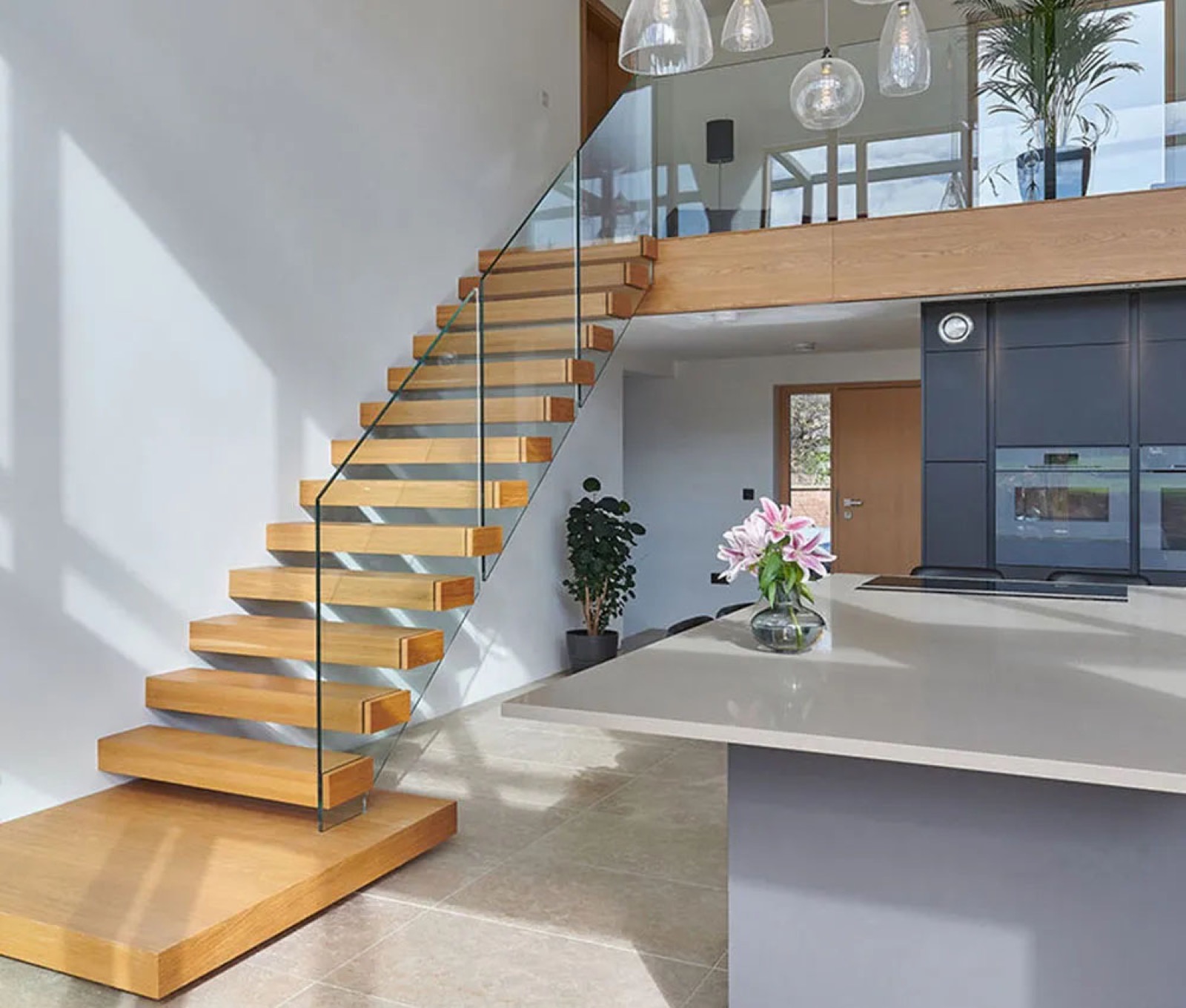 Floating wood staircase with glass railing, wider angle