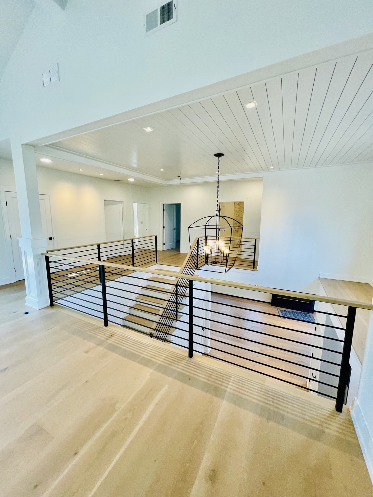 Horizontal iron railing on open loft