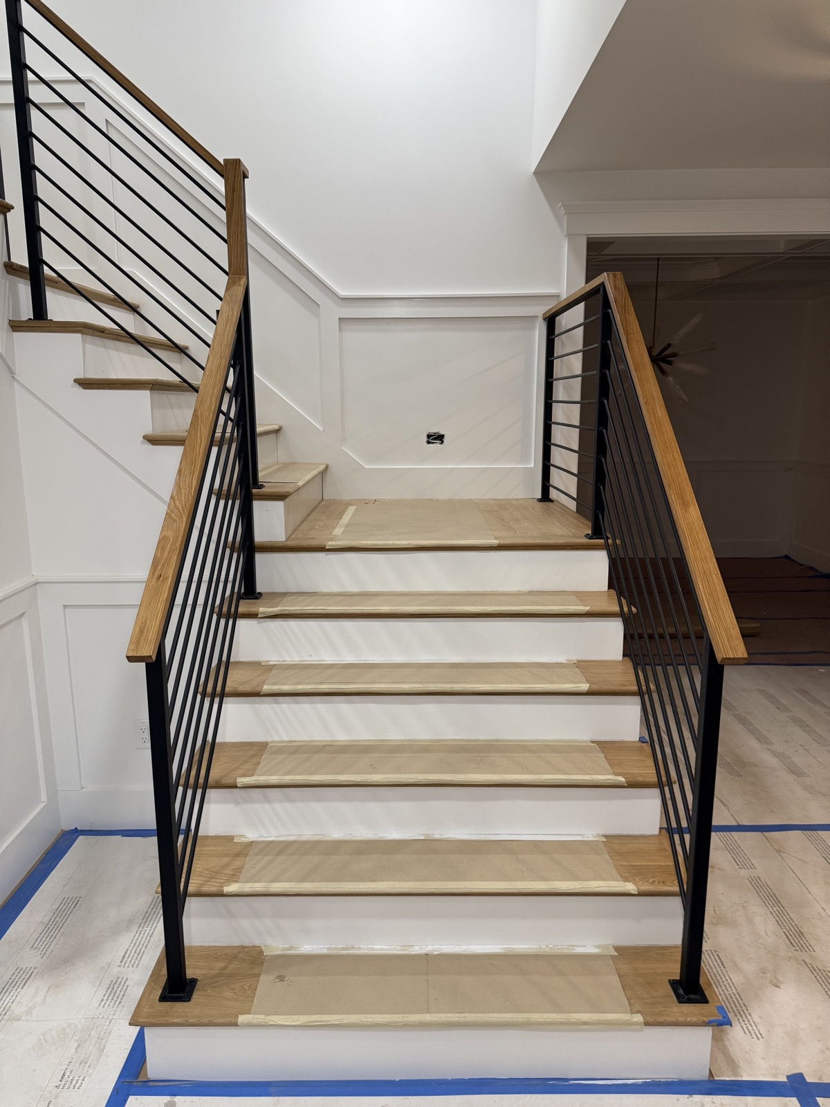 Horizontal iron railing going up staircase