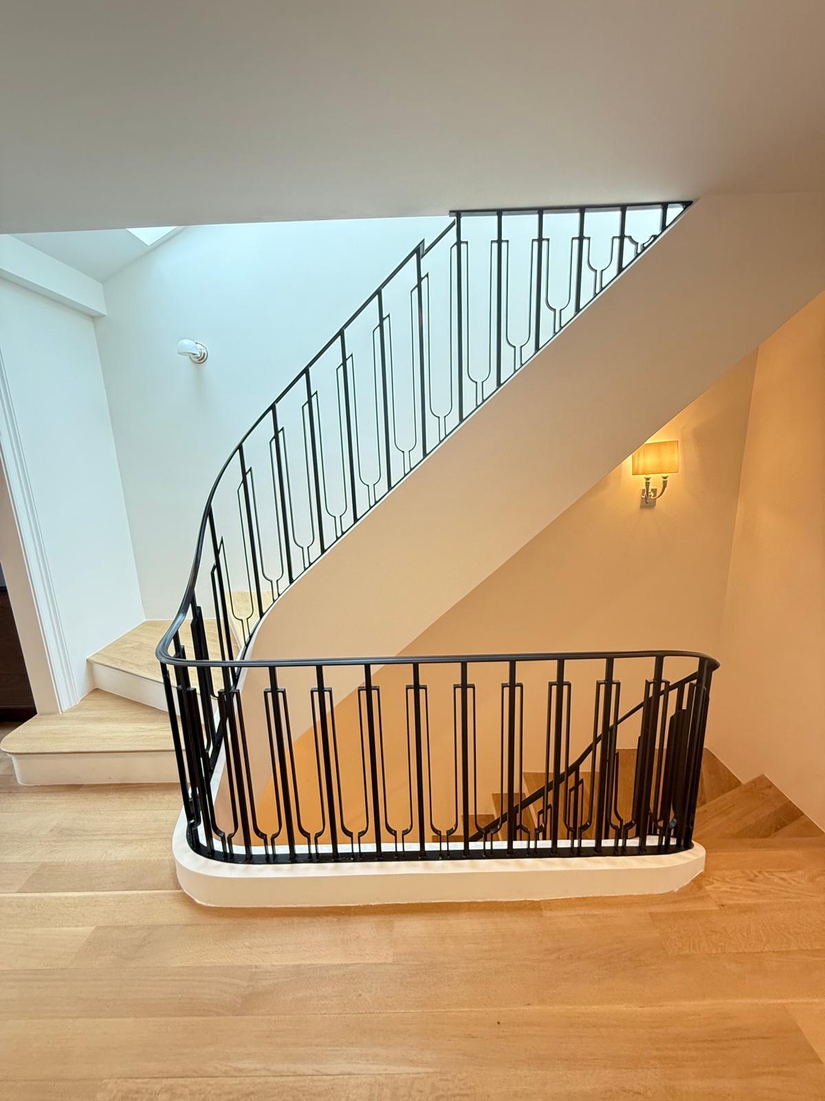 Curved iron staircase with traditional design