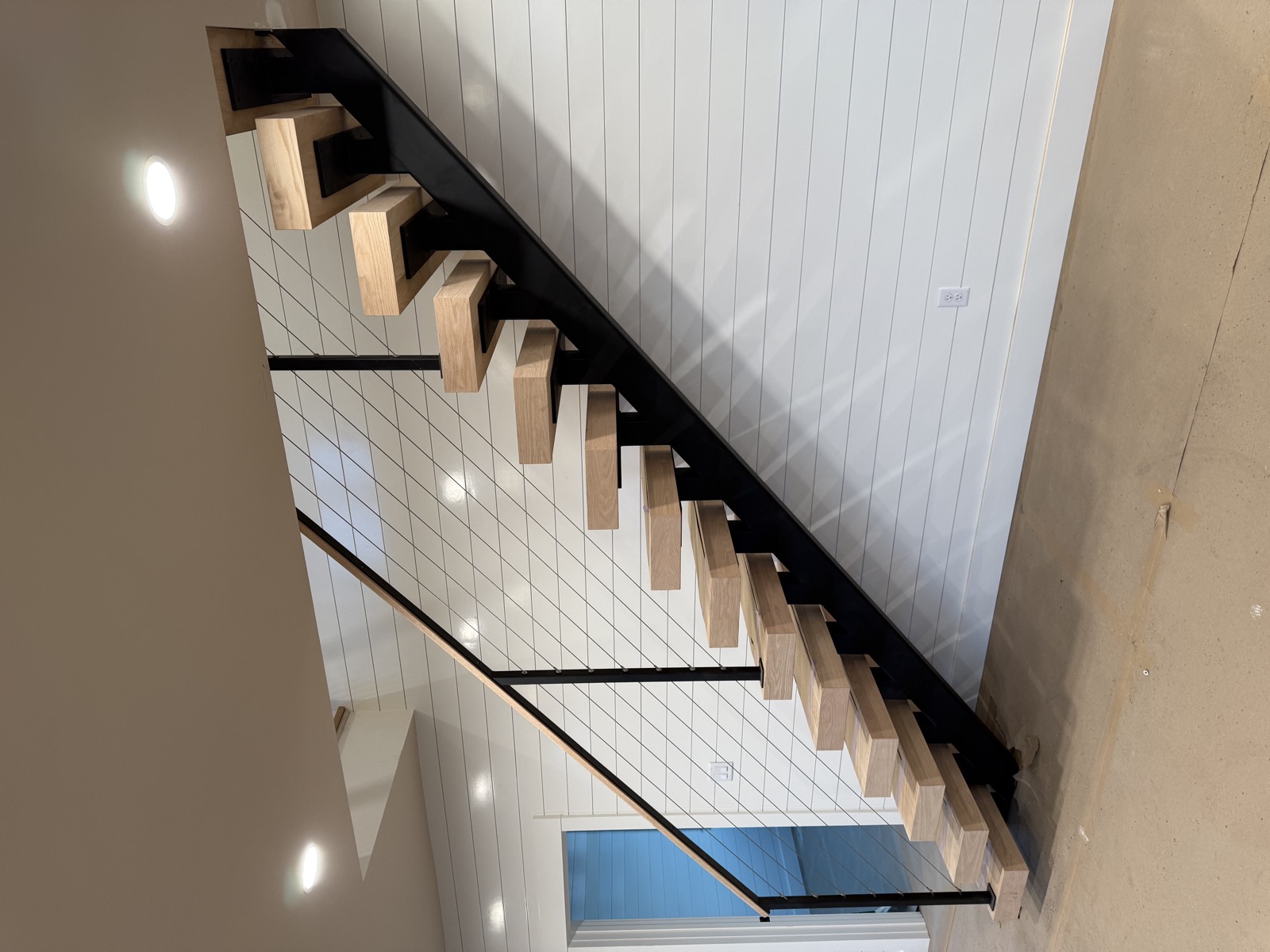 Staircase installation with modern railings