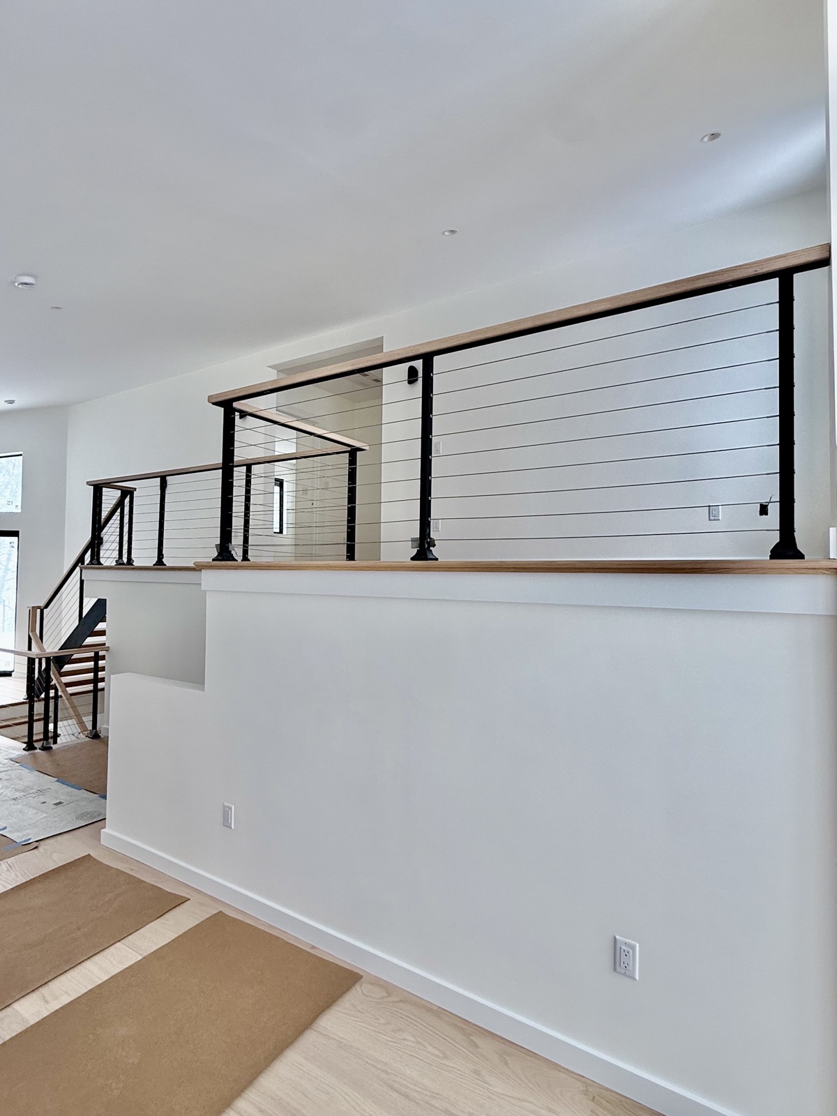 Cable railing on upper level landing